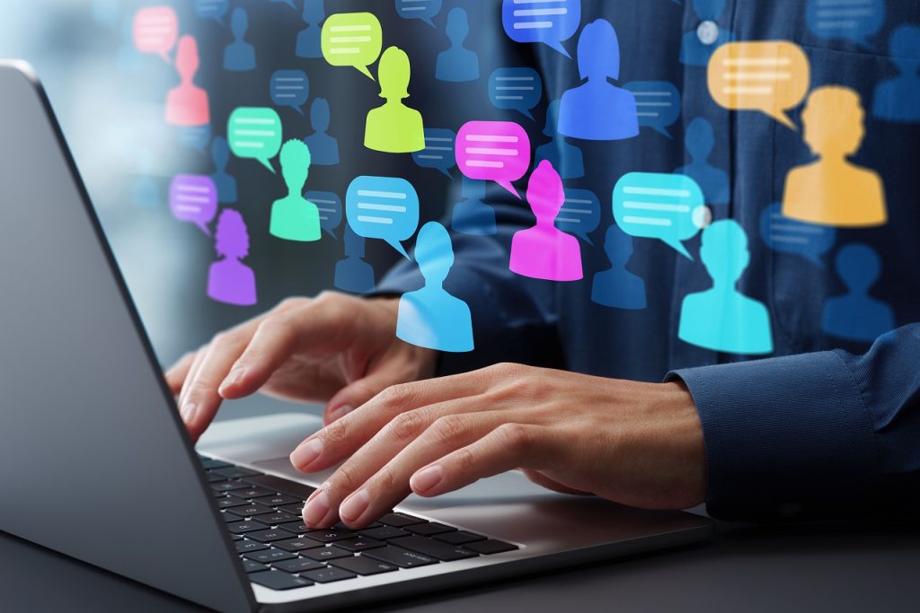 SNS chat messages and communications. Analysis of social media communication for marketing. Marketer using laptop computer to analyze social media trends.